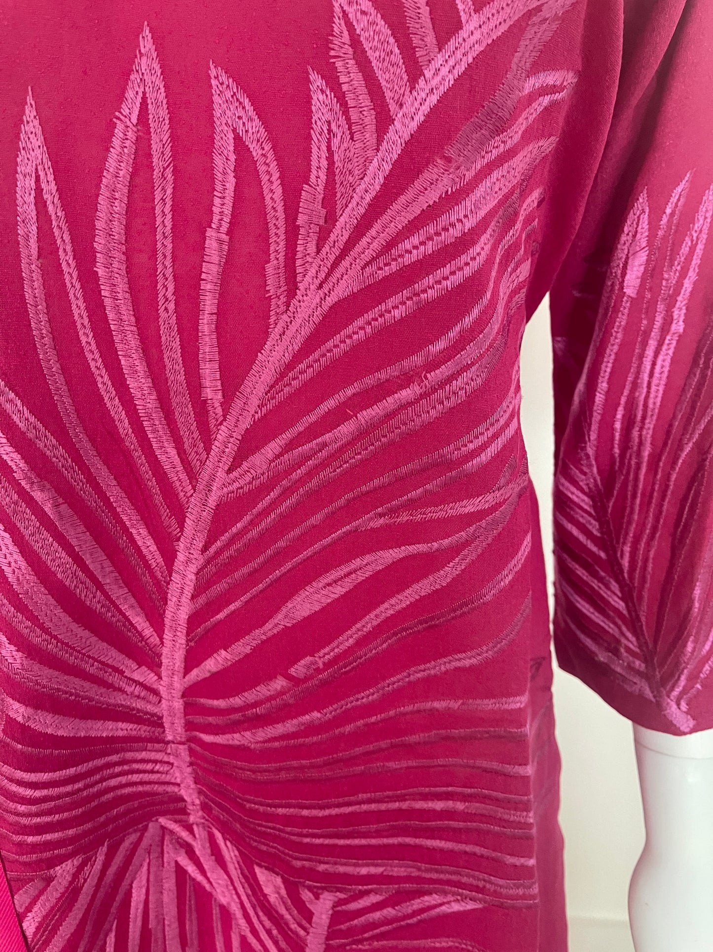 Shirt has gorgeous pink thread